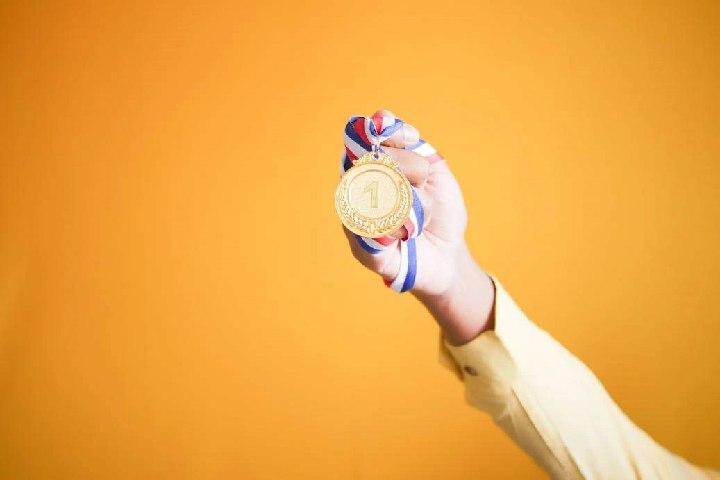 A person holding a medal.
